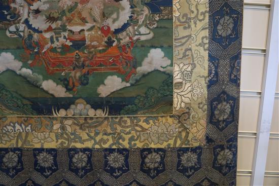 A thangka depicting Padmasambhava in the form of Nyima Ozer, Tibet, 19th century Total dimensions 133cm x 86cm